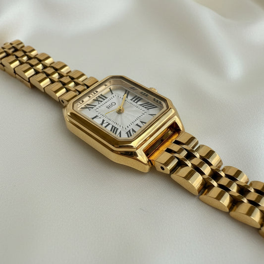 Reloj dorado numeros romanos